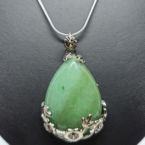 Silver plated chain w/green aventurine pendant.